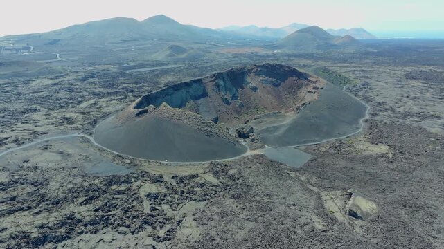 Drone footage showing the El Cuervo volcano and surrounding lava fields in Lanzarote, Canary Islands