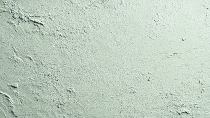 Obraz premium A light, muted green wall with visible rough texture, uneven plaster, and subtle brush strokes, creating a rugged abstract background.