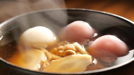 Steaming Hot Pot with Delicious Ingredients - A Culinary Delight.