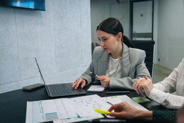 Team leader with diverse group of people employees leading meeting in office. Professional cooperation and businesspeople concept