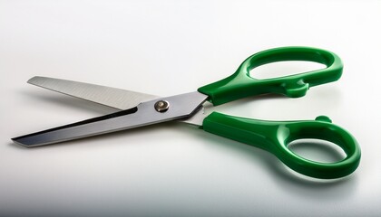green scissors featuring sharp metal blades positioned against white background ready for precise crafting and design work