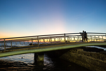 Sunset view on the footbridge at Canal 5 in Santos, Brazil
