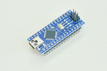 Programming board of Arduino UNO in blue colour isolated in white background