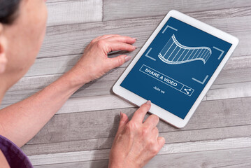 Online video sharing concept on a tablet
