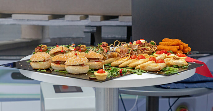 Tasty small hamburger snacks served at a company party event