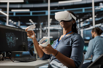 Data center engineer running diagnostic scripts using VR headset, examining equipment. Server room worker using virtual reality to evaluate rackmounts performance metrics, maintaining system stability