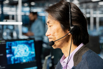 Data center engineer doing tech support, talking in mic, adjusting AI model parameters to upgrade systems. IT worker in server room speaking in audio headset microphone, scheduling checkup