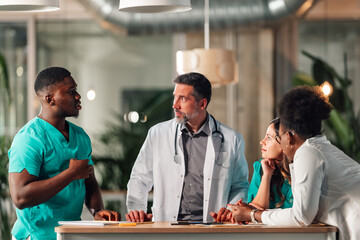 Diverse medical staff discussing healthcare strategies at meeting