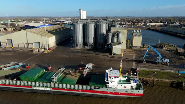 Aerial view of grain silos and ship, United Kingdom.
