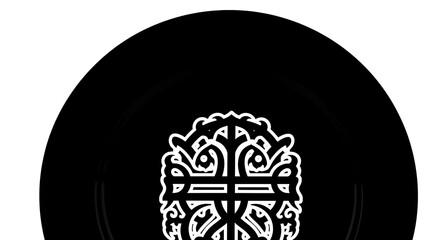 Black plate with white decorative pattern, elegant design.