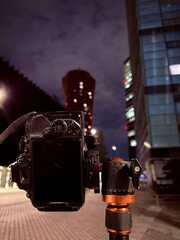 Night city camera on tripod bokeh