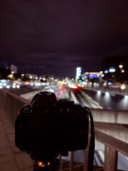 Night city camera overlooking traffic bokeh