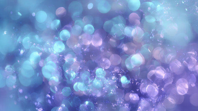 A mesmerizing abstract background featuring a cascade of sparkling blue, purple, and teal bokeh lights, creating a dreamy and ethereal glow.