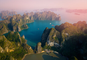 Stunning aerial view of Halong bay at sunset with limestone islands and turquoise waters