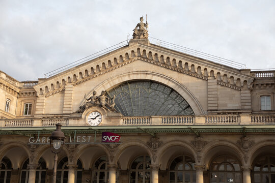 Historic facade, clock, and sculpture of Gare de l'Est train station, Paris