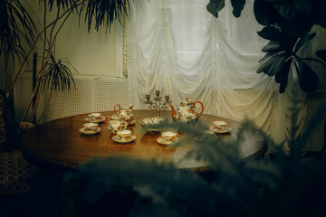 Vintage Tableware and Decorative Elements on a Wooden Table
