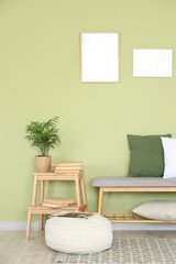 Interior of room with soft bench, stool and pouf