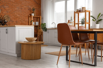 Interior of modern  kitchen with brick wall