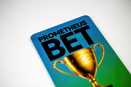A 'PROMETHEUS BET' card with a golden trophy on a vibrant blue-green gradient background, symbolizing competition, reward, and the excitement of winning.