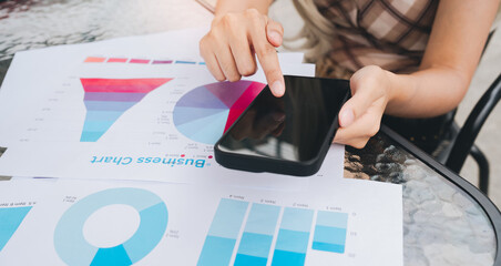Business chart smartphone hand finger data analysis graph pie chart bar chart table office technology communication digital device statistics report business finance marketing presentation