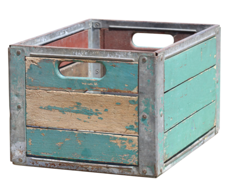 An old wood and metal crate box with teal pealing paint with a blank background.