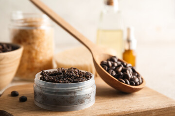 Jar with coffee body scrub on wooden background