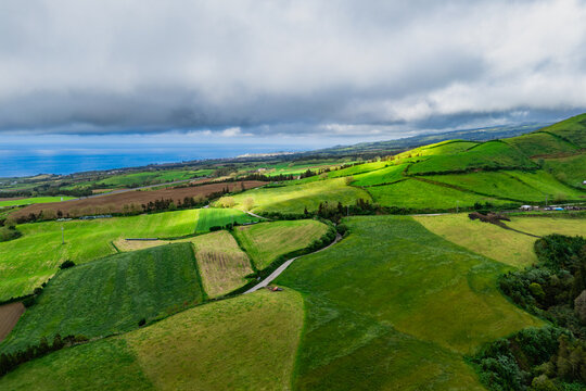 Scenic drone view of lush green pasture landscape in lush Azores, Portugal island in Atlantic ocean