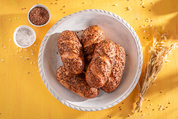 Hot and brown flax seed buns freshly baked in bakery.