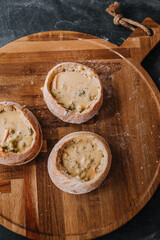 Creamy Broccoli Cheddar Soup in Fresh Artisan Bread Bowl