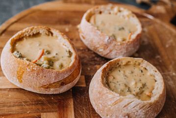 Creamy Broccoli Cheddar Soup in Fresh Artisan Bread Bowl