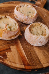 Creamy Broccoli Cheddar Soup in Fresh Artisan Bread Bowl