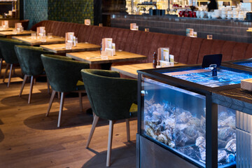 Elegant restaurant with cozy ambiance, Stylish seafood eatery featuring inviting decor and ambiance