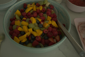A Spread of Fresh Fruit and Cured Ham