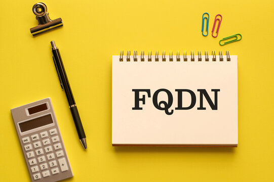 There is notebook with the word FQDN. It is an abbreviation for Fully Qualified Domain Name as eye-catching image.