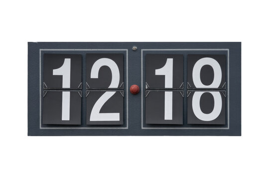 A retro split-flap display clock showing 12:18. White numbers on black panels, dark grey frame, and a central red adjustment knob. background removed