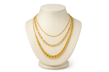 Elegant golden layered necklaces on a display, isolated on transparent background
