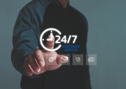 A person touching a virtual 24/7 customer service interface with digital communication icons, representing nonstop support, online assistance technology and modern service solutions.