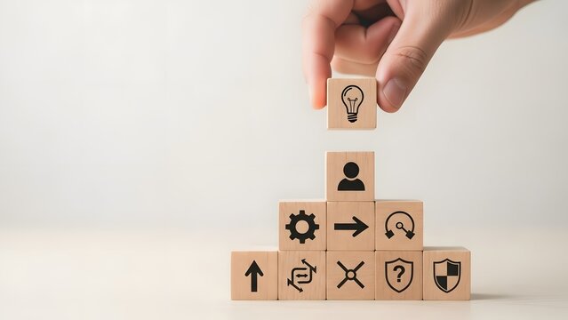 Building a business strategy with icons on wooden blocks