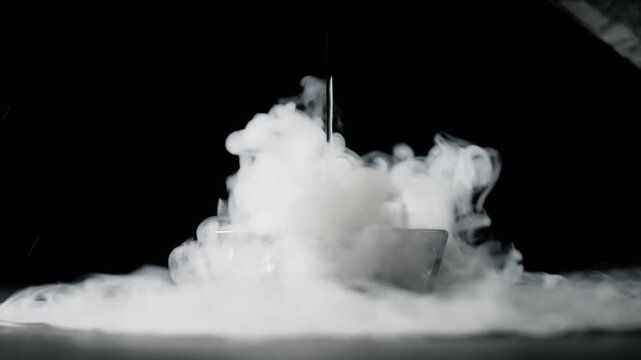 a person putting water on dry ice
