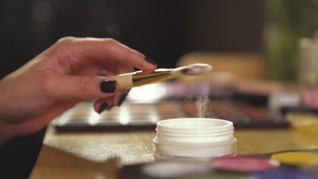 lady applying make up setting powder on her face