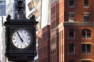 Toronto Union Station clock in front of Union Station, main city passenger transportation hub that services intercity and international connections.