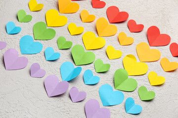 Colorful paper hearts on white background. Valentine's Day celebration © Pixel-Shot