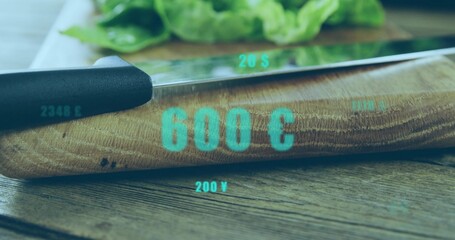 Showing curved wooden cutting board holding chef knife on table, with teal overlays and lettuce © vectorfusionart