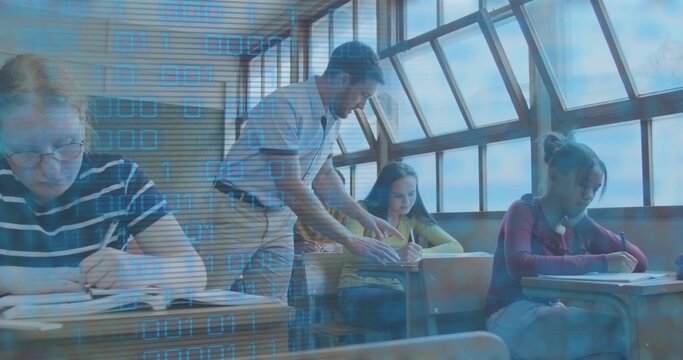 Leaning male teacher in shirt guiding students in class, pointing at notes under binary overlay
