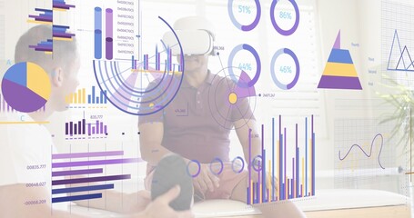 Testing man wearing white virtual reality headset and maroon polo viewing AR data charts in lounge