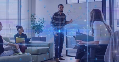 Gesturing presenter in plaid shirt and jeans pointing at whiteboard in lounge with digital overlay
