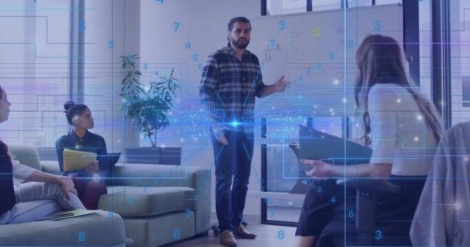 Gesturing presenter in plaid shirt and jeans pointing at whiteboard in lounge with digital overlay