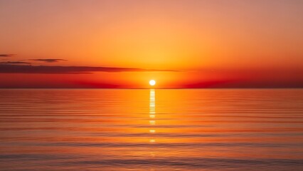 Fototapeta premium Golden sun setting over a tranquil ocean, painting the horizon with a whisk of fiery colors