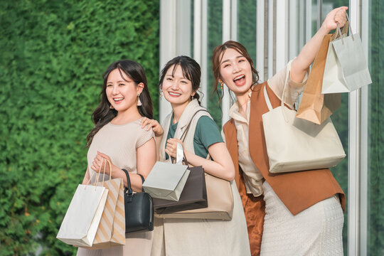 Female friends and companions enjoying shopping, sales, bargains and travel

