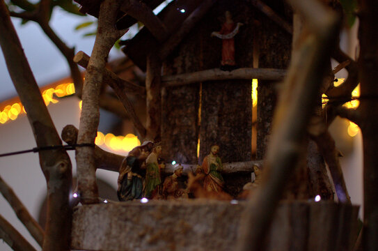 A traditional Christian nativity scene with figurines under soft light — representing the birth of Jesus and evoking faith, family tradition, and Christmas spirit. - Powered by Adobe